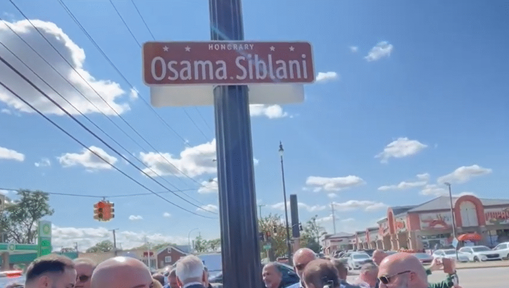 Street sign connected to the Dearborn street name controversy, highlighting the debate between Mayor Abdullah Hamoud and a Christian priest over Hezbollah links.