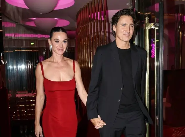 Katy Perry and Justin Trudeau smiling together at a public event in Paris, 2025