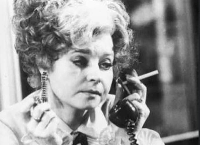 Prunella Scales and Timothy West smiling together on a canal boat during Great Canal Journeys