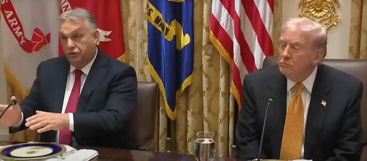 Viktor Orbán speaking at a press conference, discussing Hungary border policy and EU migration stance.