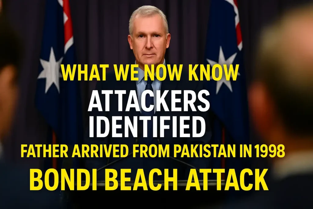 Tony Burke addressing a press conference in Sydney with Australian flags behind him following the Bondi Beach attack