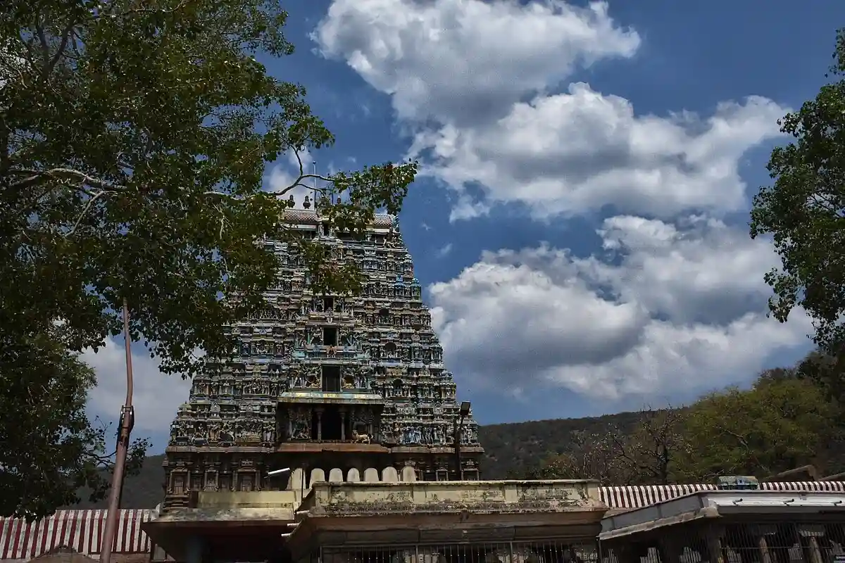 Thiruparankundram temple gopuram under a bright sky, central to the religious dispute highlighted in the Justice Swaminathan case.