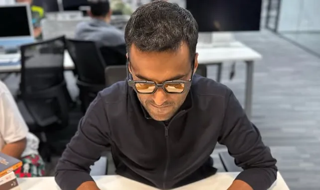 Business leader reviewing documents in a modern office setting, used as a visual reference amid the Deepinder Goyal resignation news.