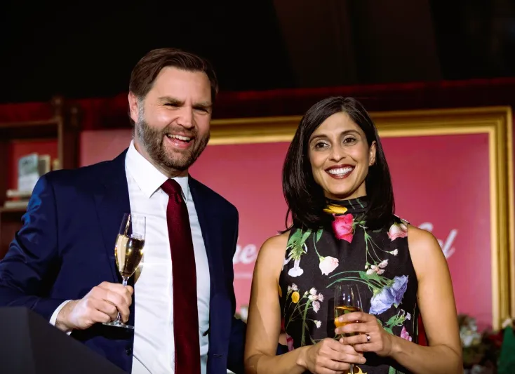 U.S. Vice President JD Vance and his wife Usha Vance attend a public event in a formal setting.