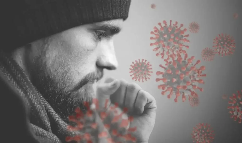 A man covering his mouth while coughing, with virus illustrations highlighting flu deaths in USA during the 2025–26 flu season.