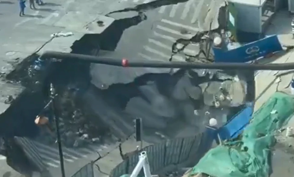 Massive sinkhole in Shanghai swallowing a large section of roadway near a construction site in Minhang District