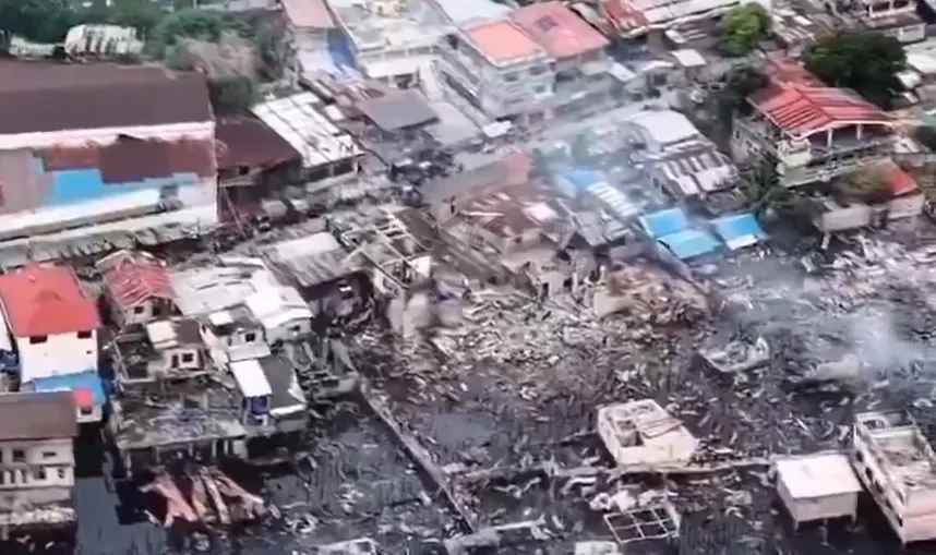 Aerial view of widespread destruction after the Tawi-Tawi fire incident, showing burned homes and debris in Barangay Lamion, Bongao