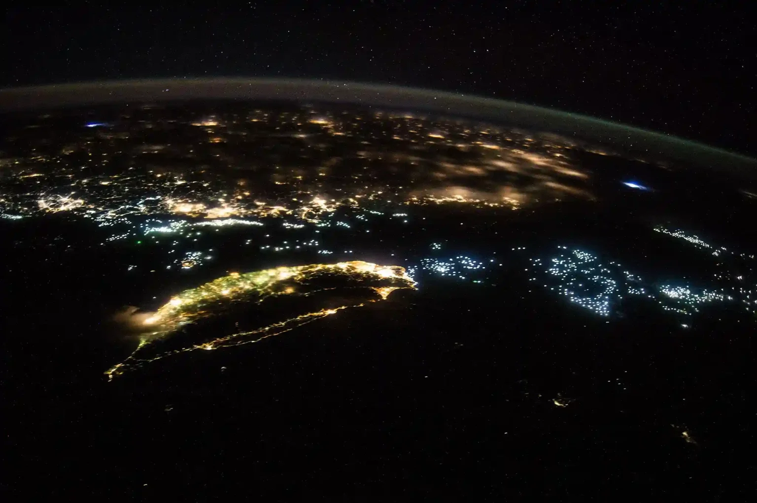 Satellite view of Taiwan and mainland China at night highlighting the Taiwan Strait amid rising China–Taiwan tensions.