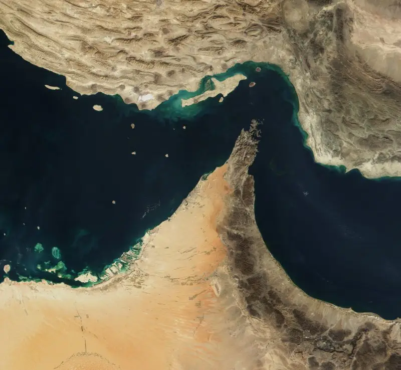 Global shipping routes through the Strait of Hormuz showing oil tanker traffic and strategic maritime chokepoint