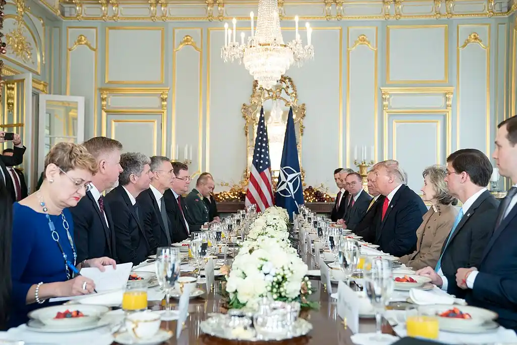 Donald Trump speaking at a NATO leaders breakfast during discussions on defense spending and alliance commitments amid the ongoing NATO power shift