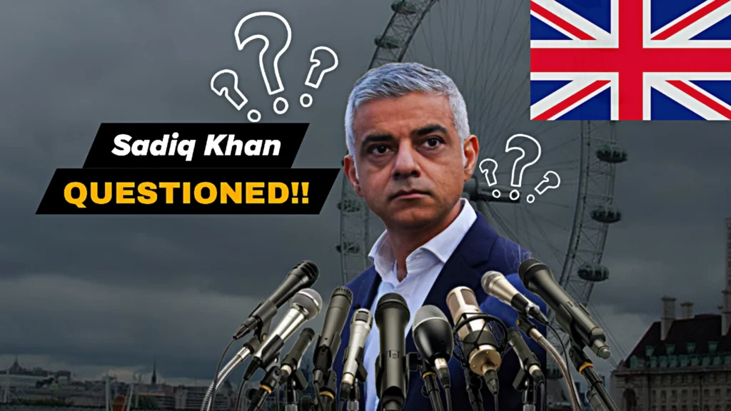 Sadiq Khan City Hall debate image showing the London Mayor surrounded by microphones during intense questioning over crime, transport, and governance issues in London.